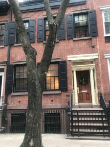 Picture of an apartment building near a NYC park.